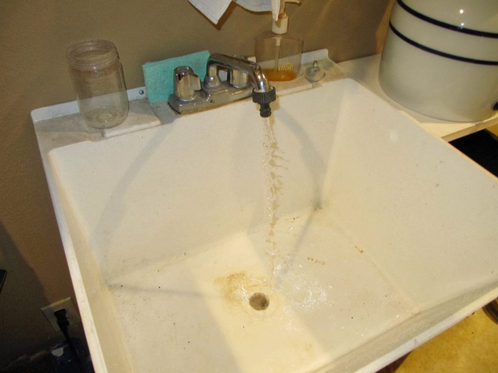 photo of water flowing in a sink