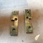photo of Brass end plates before and after buffing