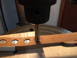 photo of A drill press jig swedges the lead . . .