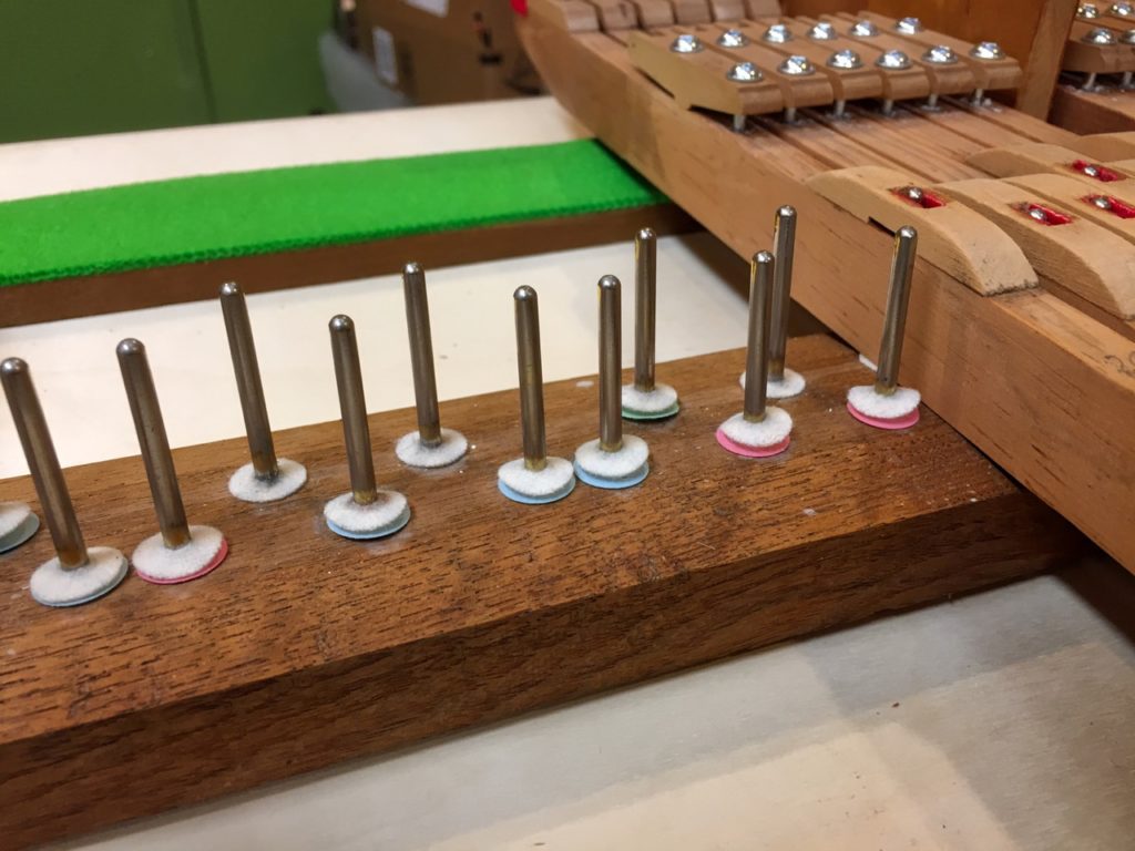 photo of Balance rail with various punchings to correct key height
