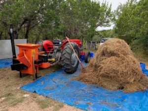photo of Massey Ferguson 65 ready to shred bluebonnet hay