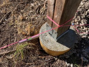 photo of concrete pier with measurement string