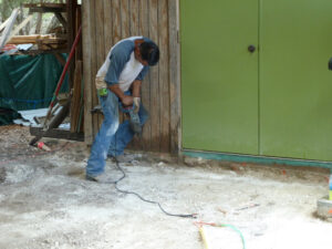photo of Joe Removing concrete spoil from shop slab