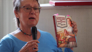 photo of Marilyn McCray talking about her book