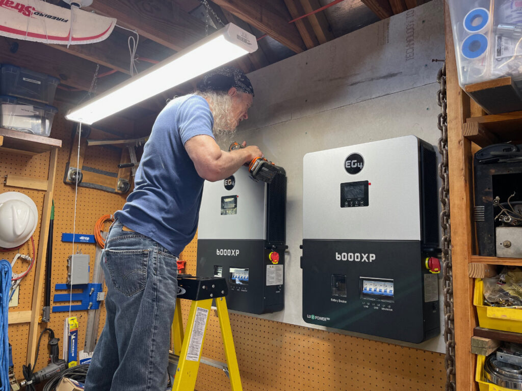 photo of Joe mounting an inverter