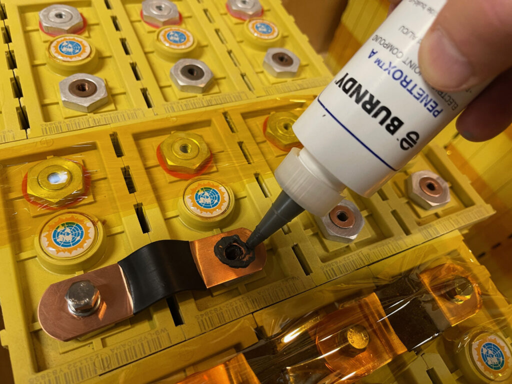 photo of applying Burndy's Joint Compound to cells