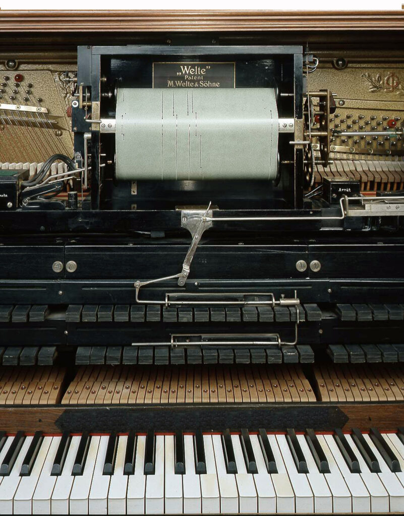 Welte-Mignon reproducing piano mechanism with action removed, showing the pneumatic playback system